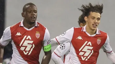 Monaco players celebrate