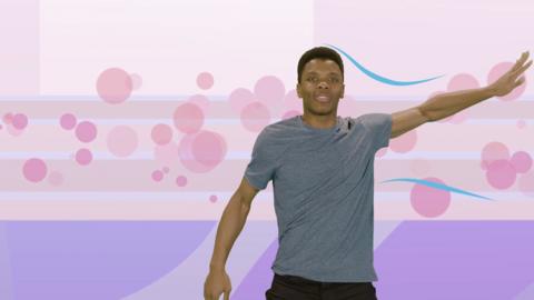 Presenter Rhys Stephenson dancing on a purple backdrop.