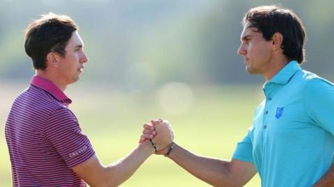 Tom McKibbin and Matteo Manassero shake hands on the 18th green