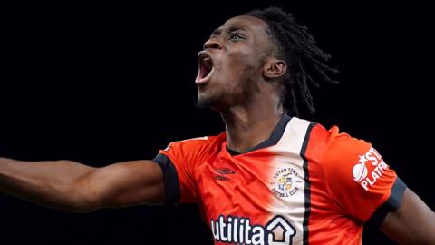 Elijah Adebayo celebrates scoring for Luton