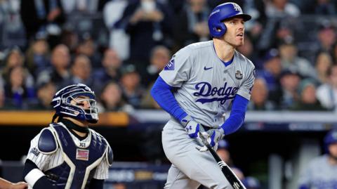 Los Angeles Dodgers first baseman Freddie Freeman hits a home run in the first inning of game three of the World Series