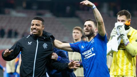 Rangers' Hamza Igamane (L) and Nicolas Raskin celebrate at full time during a UEFA Europa League 2024/25 League Phase MD5 match between OGC Nice and Rangers at the Stade de Nice