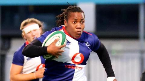 Ireland's Linda Djougang scores a try