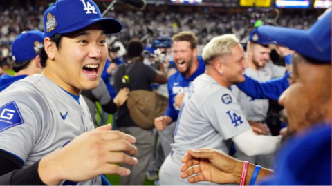 Shohei Ohtani celebrates with his team-mates after the Los Angeles Dodgers win the 2024 World Series