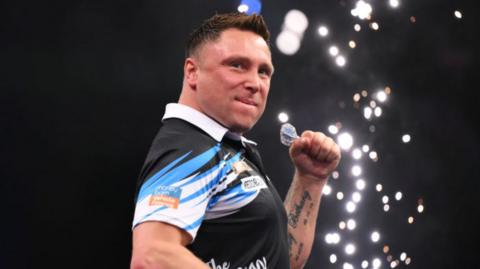 Darts player Gerwyn Price celebrates