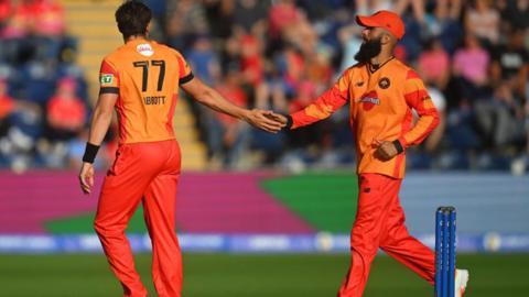 Moeen Ali and Sean Abbott celebrate a wicket for Birmingham Phoenix