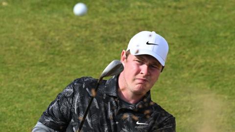 Robert MacIntyre hits a bunker shot