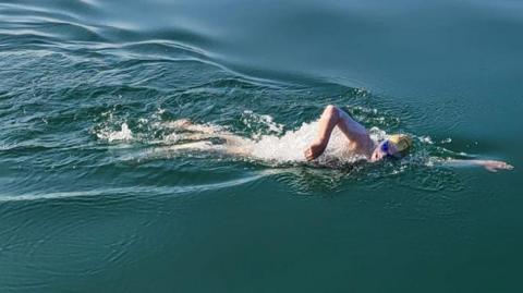 Swimmer Sam Farrow in Lake Geneva 