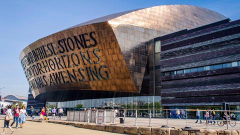 A landscape photo of the distinctive Wales Millennium Centre at Cardiff Bay.