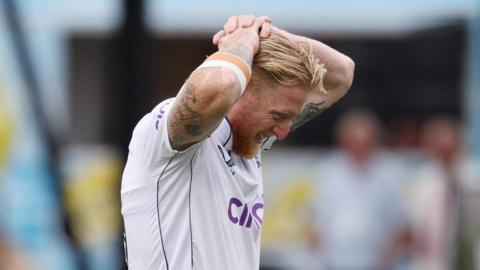 England captain Ben Stokes puts his hands on his head as he leaves the field injured