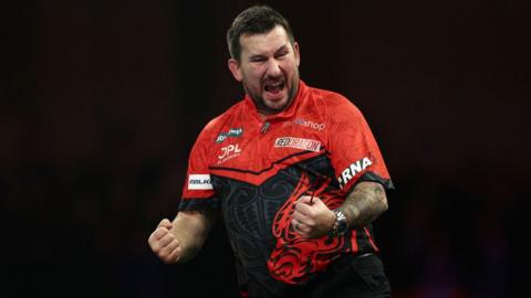 Welsh darts player Jonny Clayton celebrates