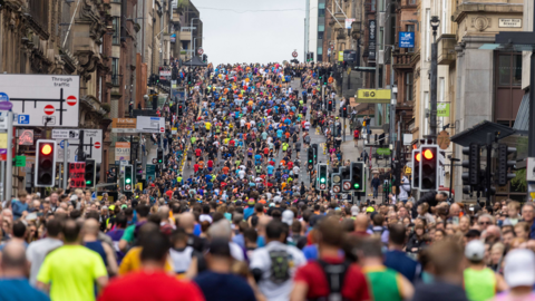 Thousands of runners make their way up St Vincent Street in Glasgow city centre shortly after starting the Great Scottish Run