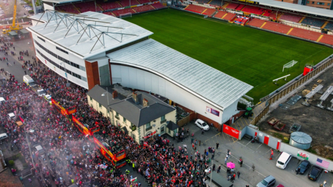 Fans outside Racecourse Ground