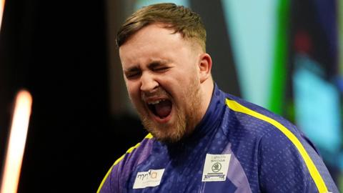 Luke Littler celebrates winning night 10 of Premier League Darts in Manchester