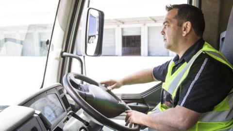 Lorry driver leaving a warehouse