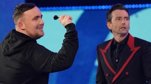 Darts player Luke Littler with actor David Tennant on Comic Relief