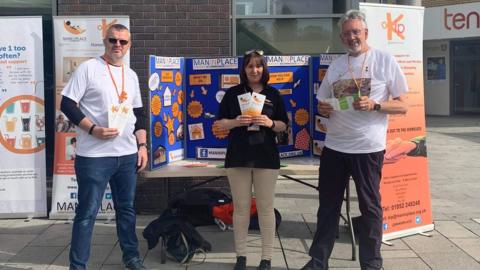 Kelly Middleton with two volunteers from Man In Place, a local charity for people are homeless