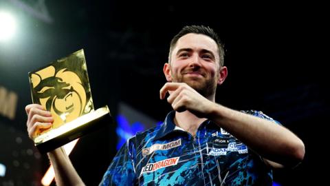 Luke Humphries celebrates winning the Premier League Darts in Brighton in 2024