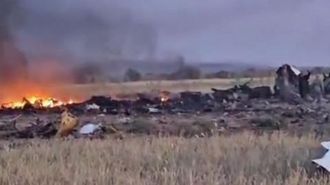 Screengrab of the crash site showing flames in Darfur