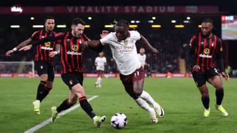 Jeremy Doku of Manchester City and Adam Smith of Bournemouth during the Premier League match between AFC Bournemouth and Manchester City at Vitality Stadium