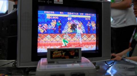 Street Fighter II being played on an old TV.