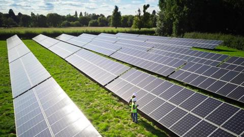 Stock image of a solar farm in the countryside