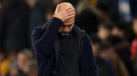 Manchester City manager Pep Guardiola in despair during the derby defeat to Manchester United