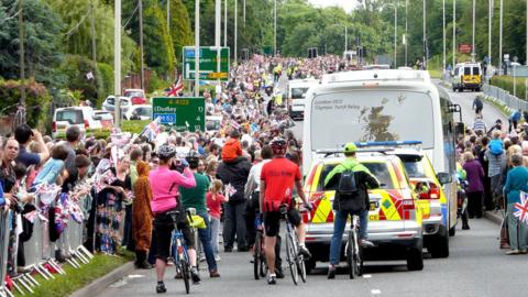 Crowds on the road during the 2012 Olympic torch relay.