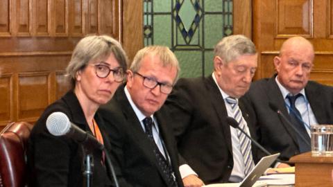 MLCs Dawn Kinnish, Paul Craine, Peter Greenhill and Bill Henderson sitting in the legislative Council listening to evidence.