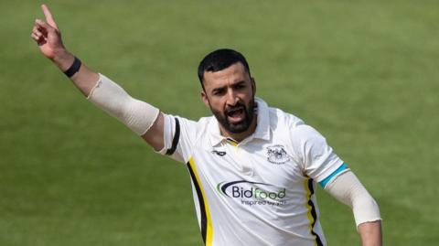 Zafar Gohar takes a wicket for Gloucestershire