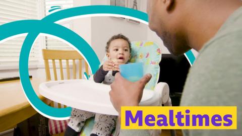 Baby and parent smiling together at mealtimes. 