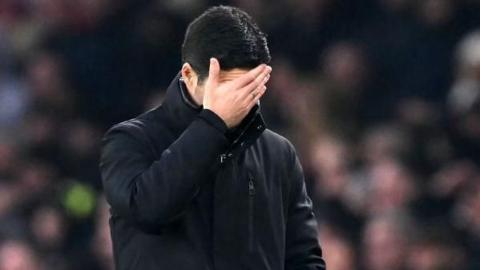 Arsenal manager Mikel Arteta holds his head in anguish during the FA Cup Third Round defeat against Manchester United at Emirates Stadium