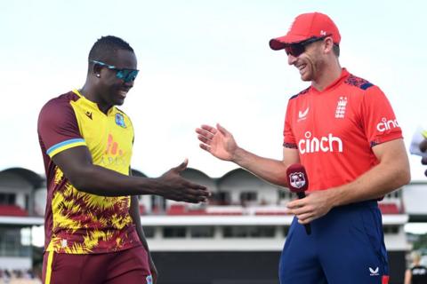 Jos Buttler and Rovman Powell share a joke