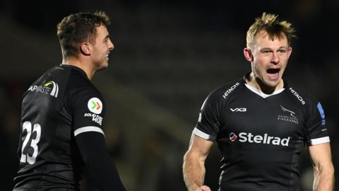 Adam Radwan (left) and Sam Stuart celebrate Newcastle's win over Saracens.