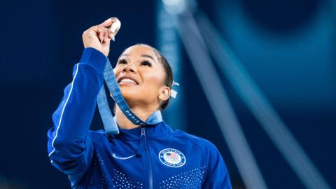 Jordan Chiles holds her bronze medal