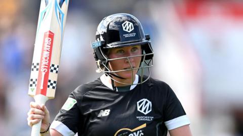 Beth Mooney of Manchester Originals raises her bat