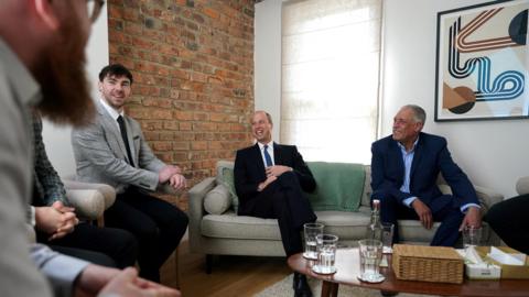 Prince William speaking to staff at James' Place 