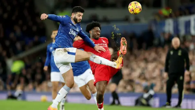 Armando Broja of Everton and Ola Aina of Nottingham Forest battle for possession