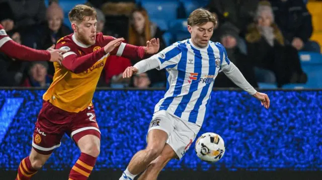 Kilmarnock's Fraser Murray (R) and Motherwell's Ewan Wilson (L) in action during a William Hill Premiership match between Kilmarnock and Motherwell