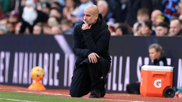 Manchester City manager Pep Guardiola looks dejected