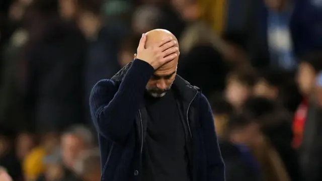 Pep Guardiola, Manager of Manchester City, looks dejected during the Premier League match between Manchester City FC and Manchester United FC at Etihad Stadium