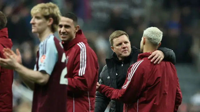 Eddie Howe, Manager of Newcastle United, interacts with Bruno Guimaraes