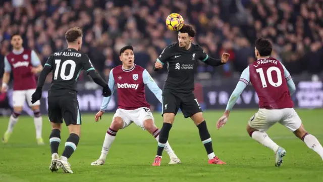 Curtis Jones of Liverpool is challenged by Edson Alvarez of West Ham