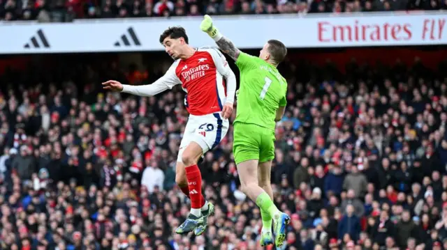 Kai Havertz of Arsenal competes for a header as Jordan Pickford of Everton attempts to punch the ball clear