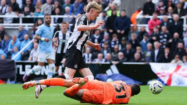 Anthony Gordon is fouled by Ederson