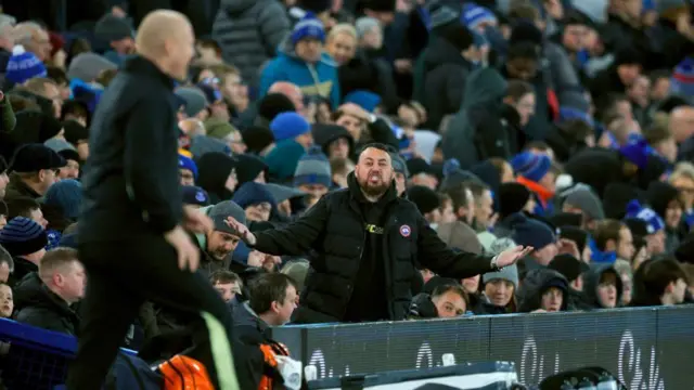 A supporter of Everton FC directs comments to Everton manager Sean Dyche