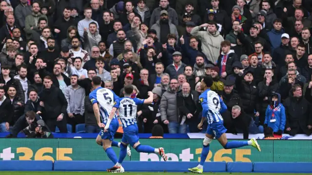 Lewis Dunk of Brighton celebrates in front of Crystal Palace supporters