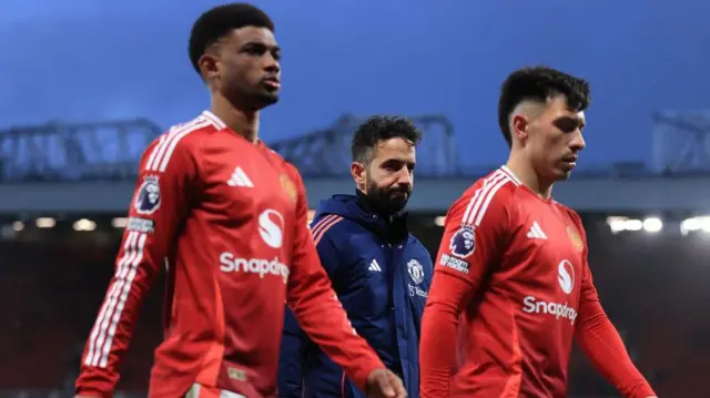 Ruben Amorim and two Man Utd players walk to the tunnel