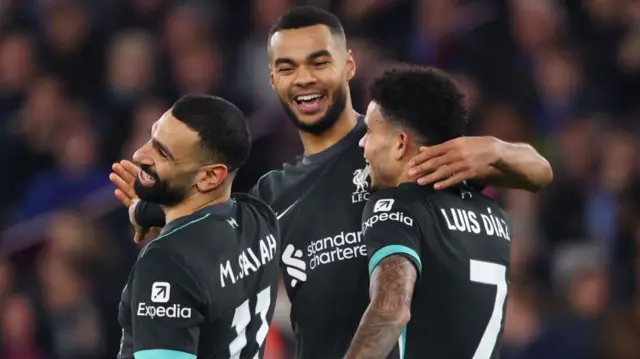 Cody Gakpo of Liverpool celebrates scoring the second goal with Mohamed Salah and Luis Diaz of Liverpool during the Premier League match between West Ham United FC and Liverpool FC at London Stadium