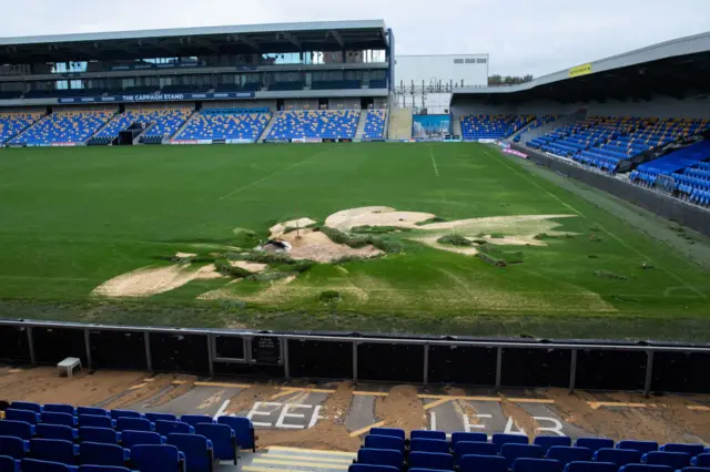 General view of damage to the pitch following flooding at The Cherry Red Records Stadium on September 24, 2024 in Wimbledon, England.